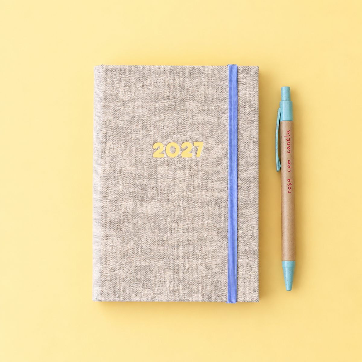 PRÉ-VENDA Agenda A6 Diária 2027 Tecido 265 (Elástico Azul)